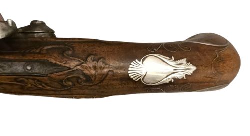 QUEEN ANNE SILVERMOUNTED 18 BORE FLINTLOCK HOLSTER PISTOL BY R WILLOUGHBY BIRMINGHAMEARLY 18THCENTURY ENGLISH FLINTLOCK PISTOL SILVERWIRE INLAID WALNUT GRIP SILVER GROTESQUE BUTT CAP WITH SILVER VACANT CARTOUCHES TO THE TOP AND THE SIDE OF THE STOCK CIRCA 1730 - ADDITIONAL PHOTO 17