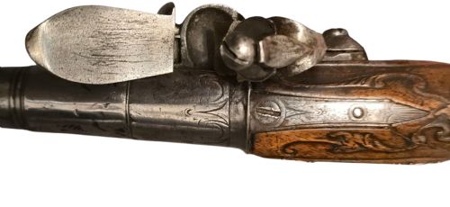 QUEEN ANNE SILVERMOUNTED 18 BORE FLINTLOCK HOLSTER PISTOL BY R WILLOUGHBY BIRMINGHAMEARLY 18THCENTURY ENGLISH FLINTLOCK PISTOL SILVERWIRE INLAID WALNUT GRIP SILVER GROTESQUE BUTT CAP WITH SILVER VACANT CARTOUCHES TO THE TOP AND THE SIDE OF THE STOCK CIRCA 1730 - ADDITIONAL PHOTO 18