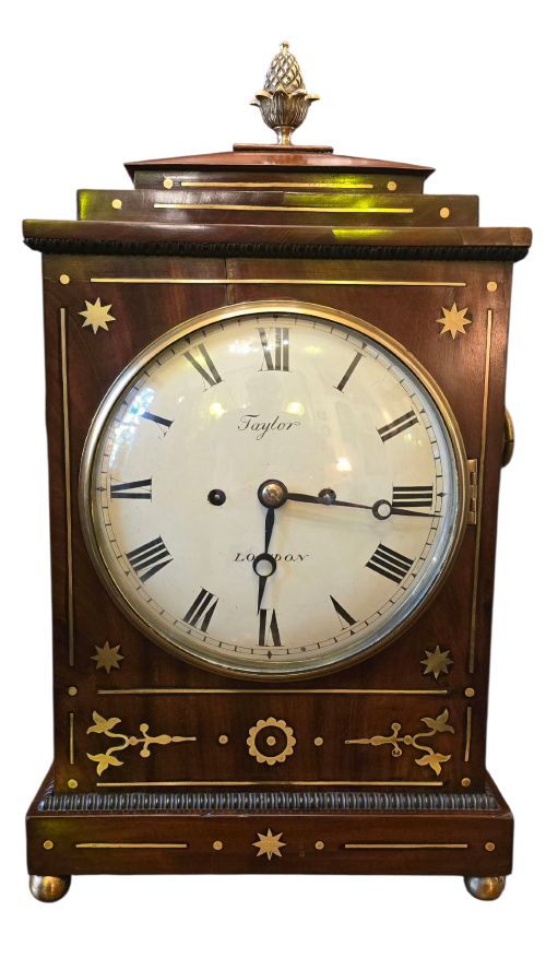 A Georgian Mahogany Chamfer Top Bracket Clock by Taylor of London.
