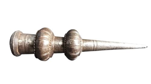 fig 1. A 17th-century forged iron spear butt with a tapered spike and two ribbed knops, mounted vertically on a dark square stand.