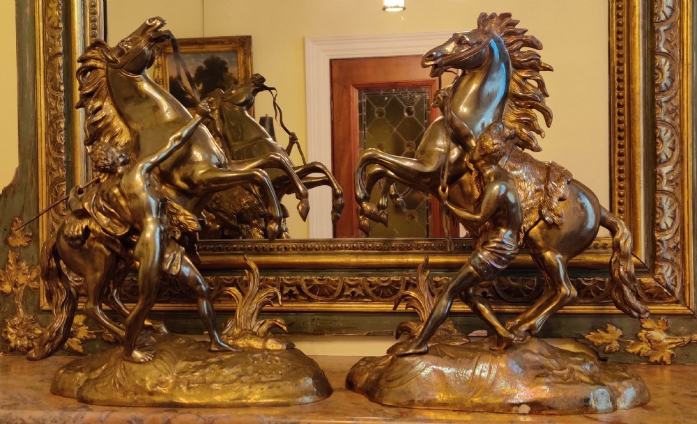 A PAIR OF LATE 19TH CENTURY GILT BRONZE FRENCH MARLY HORSES.
After GUILLAUME COSTOU THE ELDER (French, 1677-1746).  View V