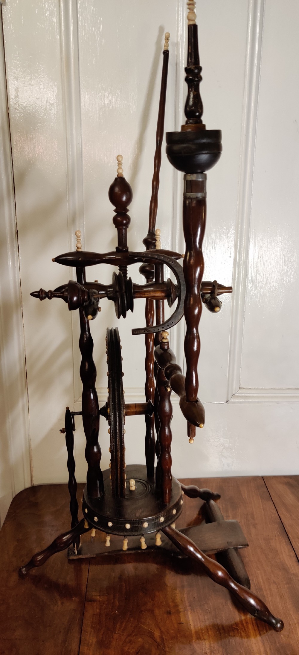 A rare Castle upright Spinning Wheel, German.  View VIII
