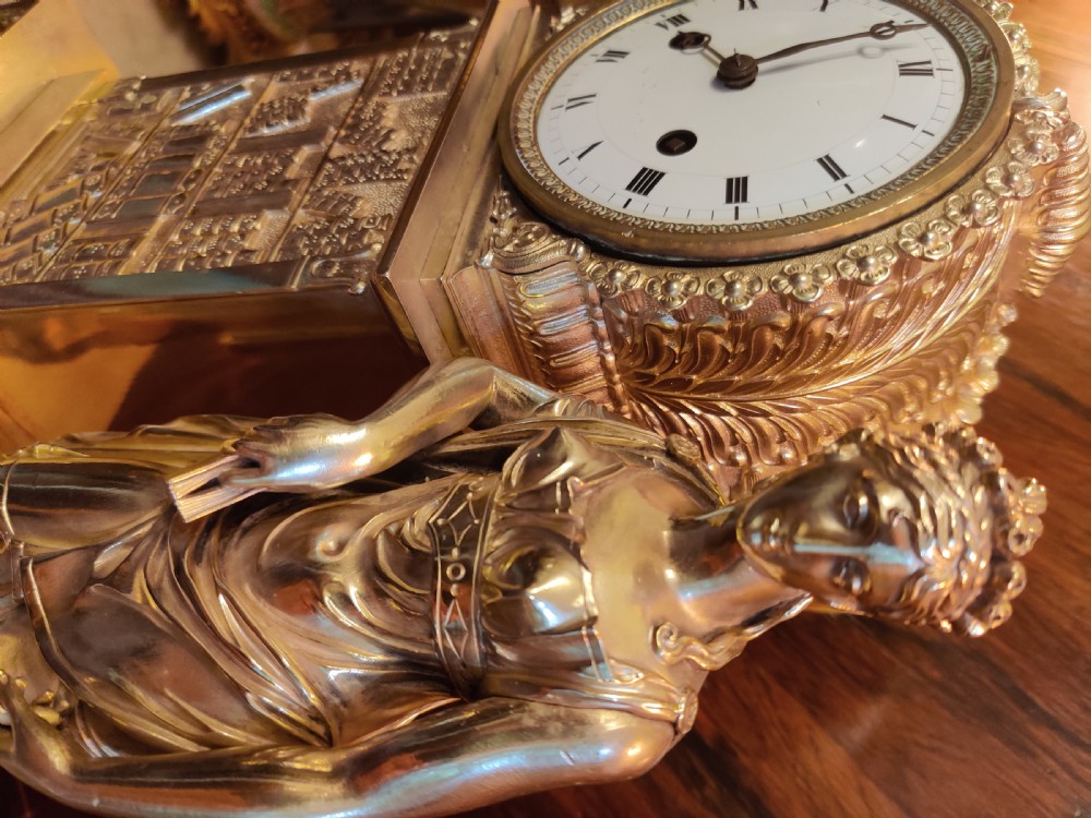 A RARE EMPIRE GILT BRONZE LIBRARY, FIGURAL MANTEL CLOCK, By 