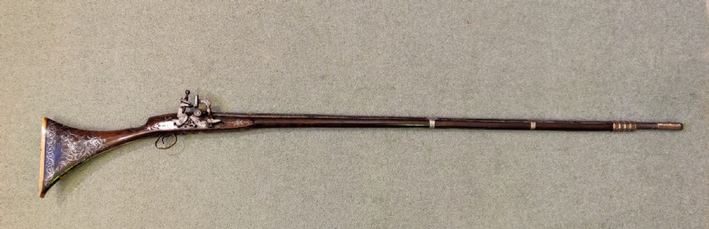 EARLY 19TH CENTURY AFGHAN JEZAIL MUSKET. Decorated with silver inlay. 