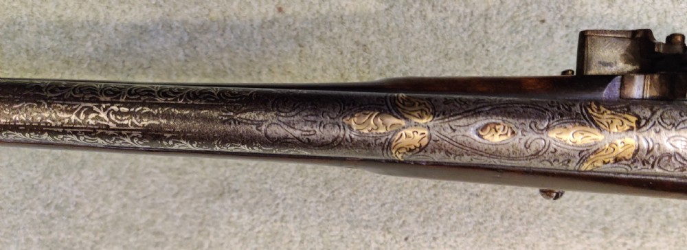 EARLY 19TH CENTURY AFGHAN JEZAIL MUSKET. Decorated with silver inlay.  View XIX