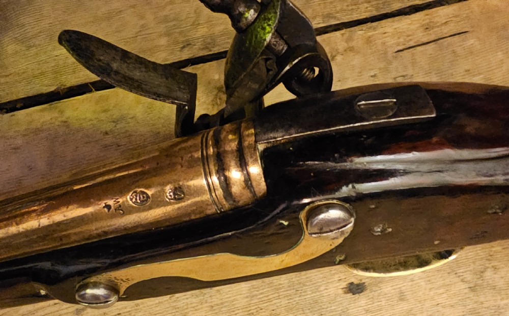A late 18th-century Light Dragoon service flintlock pistol featuring a brass barrel, dark walnut stock, and steel ignition lock mechanism. View IV