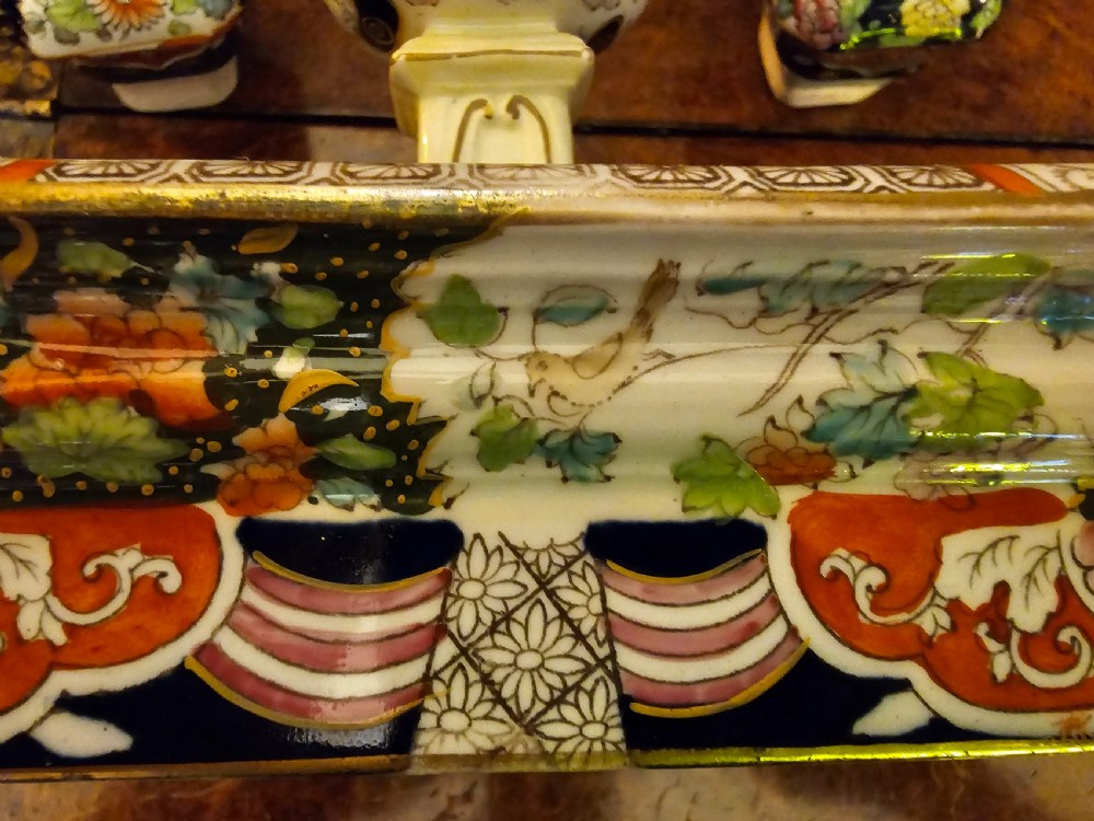 An ornate early 19th-century Masons ironstone double inkstand featuring a central sander, two lidded inkwells, and intricate Imari-style floral patterns. View V