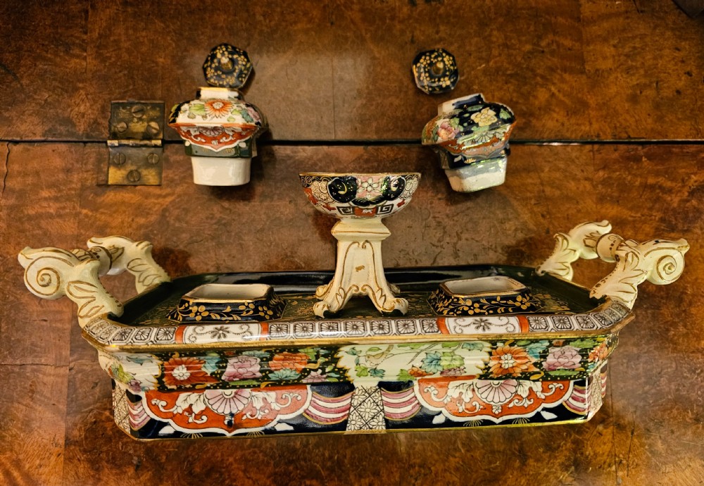 An ornate early 19th-century Masons ironstone double inkstand featuring a central sander, two lidded inkwells, and intricate Imari-style floral patterns. View VII
