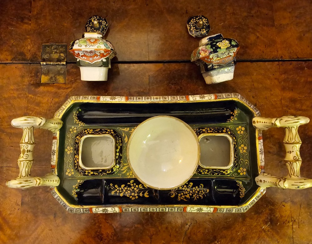 An ornate early 19th-century Masons ironstone double inkstand featuring a central sander, two lidded inkwells, and intricate Imari-style floral patterns. View IX