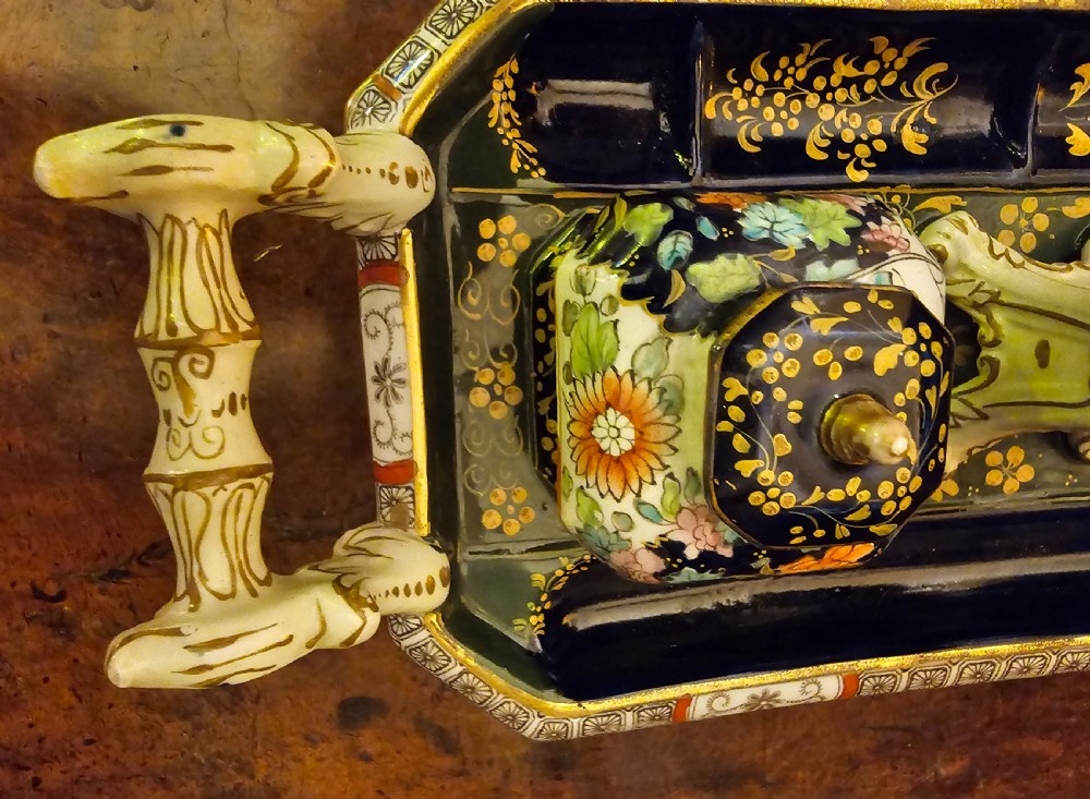 An ornate early 19th-century Masons ironstone double inkstand featuring a central sander, two lidded inkwells, and intricate Imari-style floral patterns. View XIII