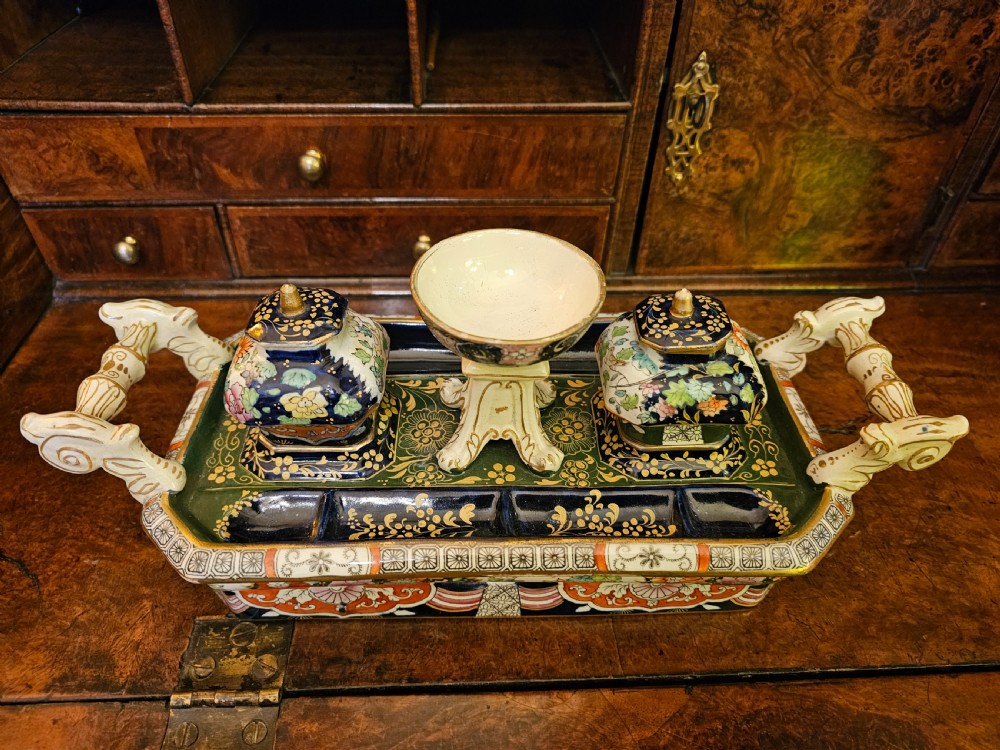 An ornate early 19th-century Masons ironstone double inkstand featuring a central sander, two lidded inkwells, and intricate Imari-style floral patterns. View XVII
