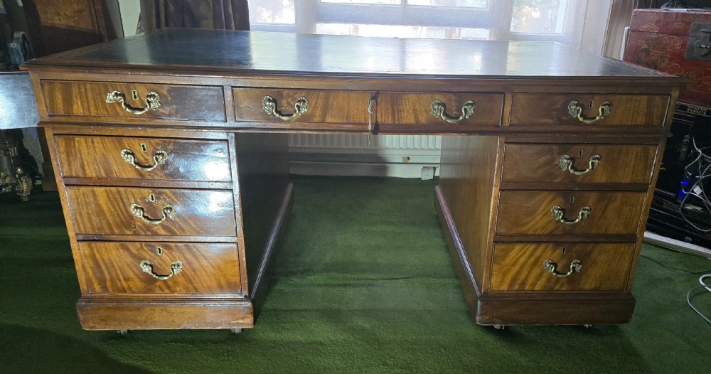 Victorian Partners Desk formally owned by The Bank of England. Flamed mahogany throughout with original leather top (circa 1880). 