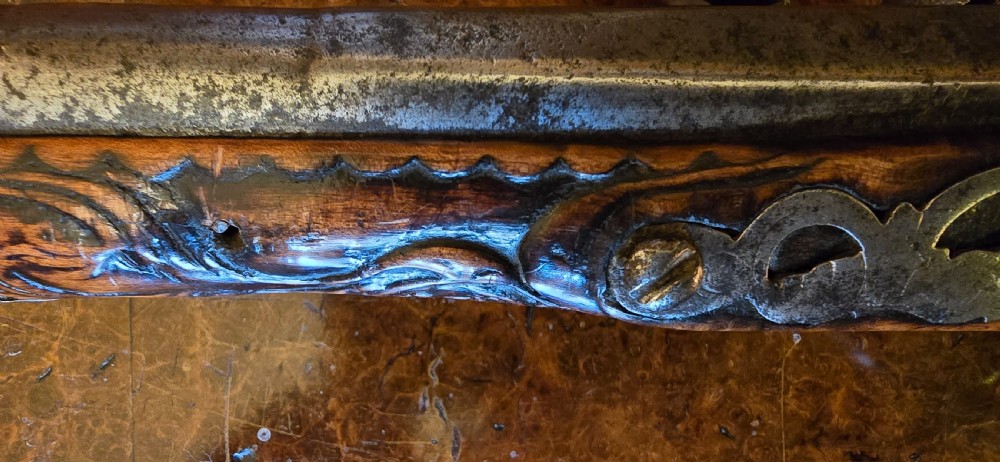 An 18th-century Balkan Ottoman flintlock holster pistol featuring a carved wooden stock, steel barrel, and a bulbous pommel. View XI
