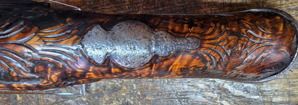 An 18th-century Balkan Ottoman flintlock holster pistol featuring a carved wooden stock, steel barrel, and a bulbous pommel. View XIV