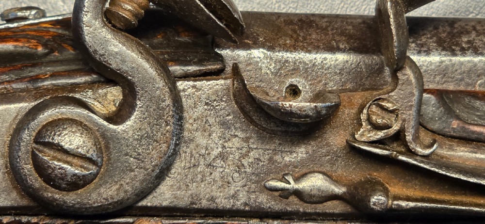 An 18th-century Balkan Ottoman flintlock holster pistol featuring a carved wooden stock, steel barrel, and a bulbous pommel. View XXV