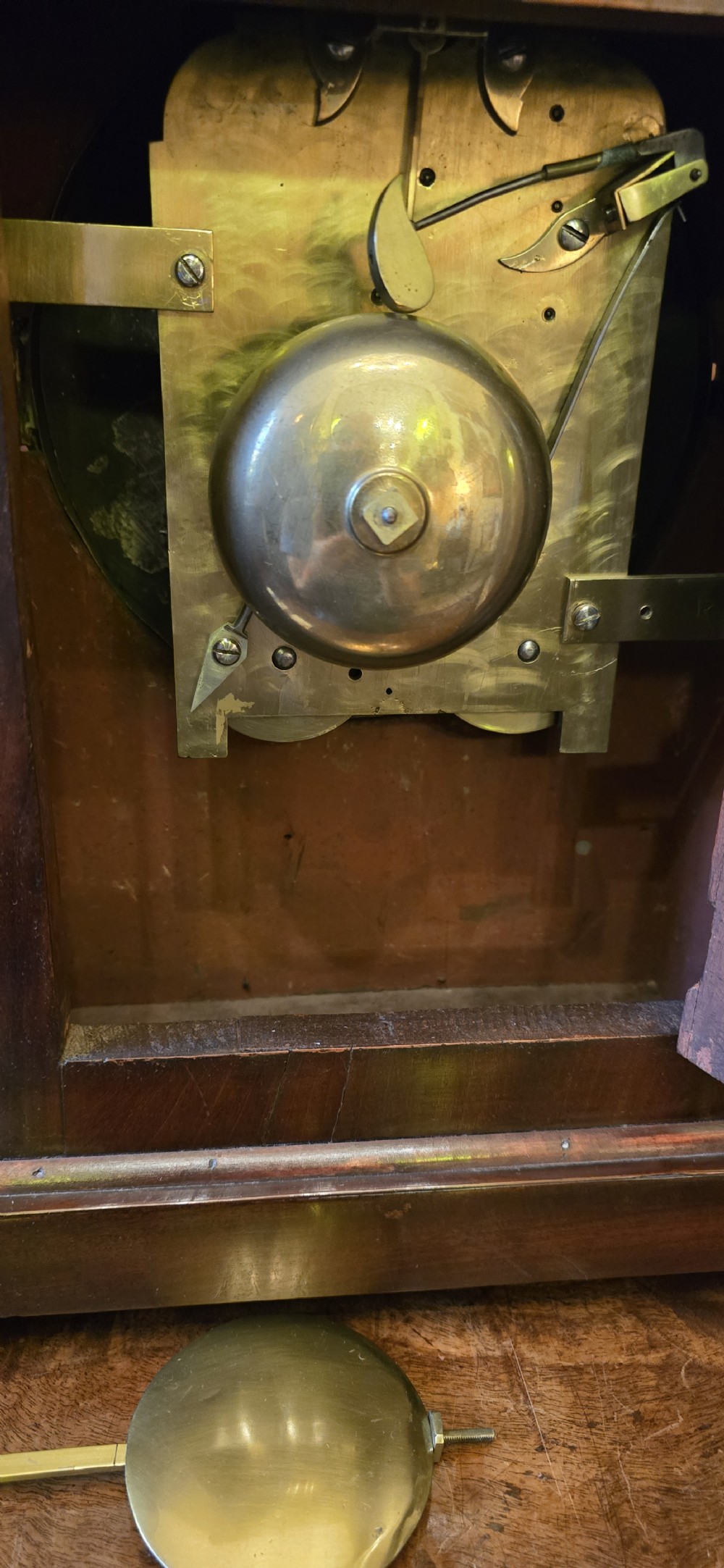 An antique Georgian mahogany bracket clock featuring brass star inlays, a top pineapple finial, and a white dial displaying Roman numerals signed Taylor London. View XV