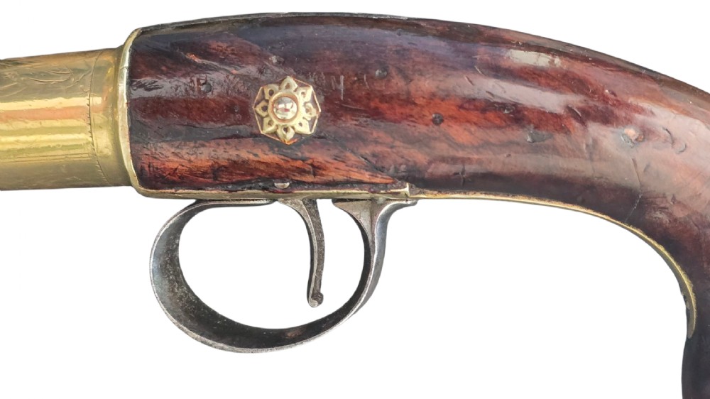 A pair of 18th-century English flintlock turn-off pistols featuring brass cannon barrels, steel lock mechanisms, and smooth walnut stocks. View XVI