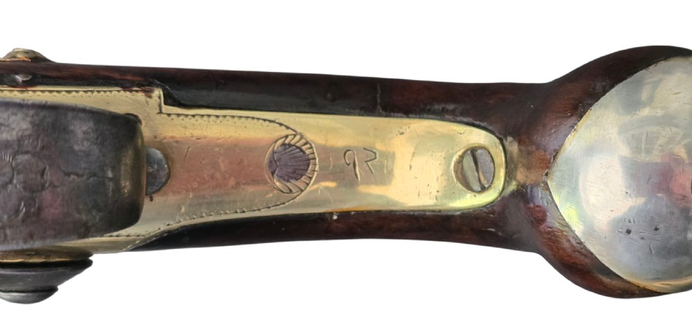 A pair of 18th-century English flintlock turn-off pistols featuring brass cannon barrels, steel lock mechanisms, and smooth walnut stocks. View XVII