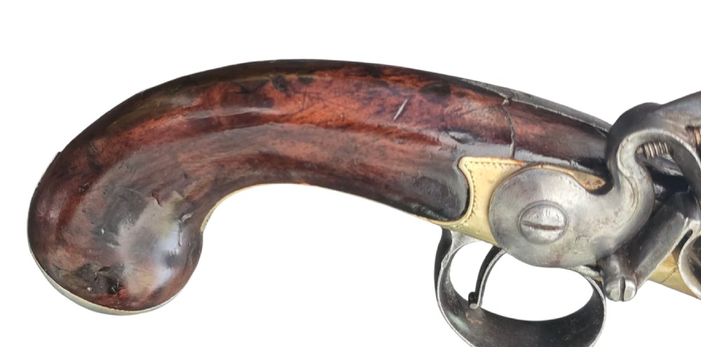 A pair of 18th-century English flintlock turn-off pistols featuring brass cannon barrels, steel lock mechanisms, and smooth walnut stocks. View XX