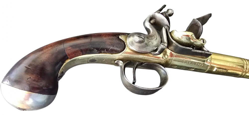 A pair of 18th-century English flintlock turn-off pistols featuring brass cannon barrels, steel lock mechanisms, and smooth walnut stocks. View XXIII