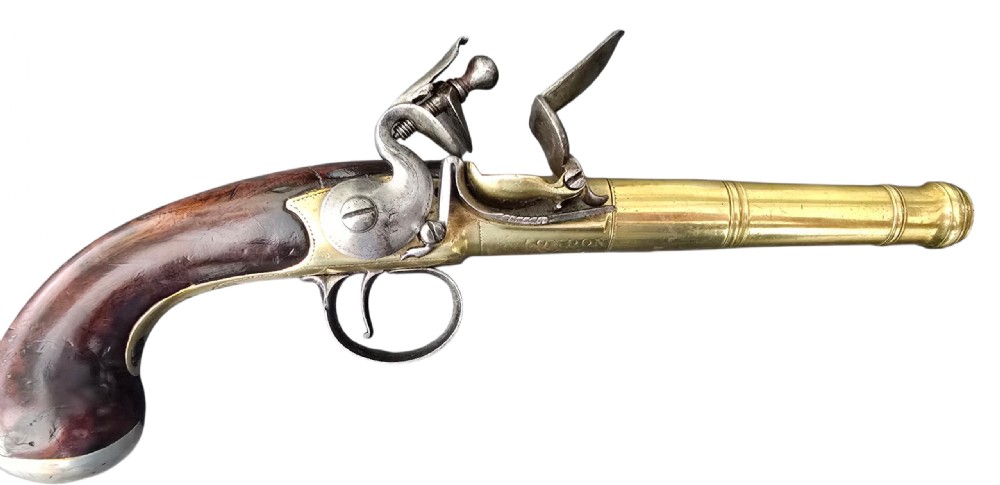 A pair of 18th-century English flintlock turn-off pistols featuring brass cannon barrels, steel lock mechanisms, and smooth walnut stocks. View XXIV