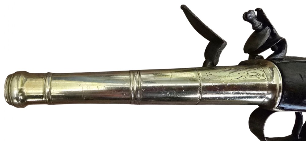 A pair of 18th-century English flintlock turn-off pistols featuring brass cannon barrels, steel lock mechanisms, and smooth walnut stocks. View XXVII