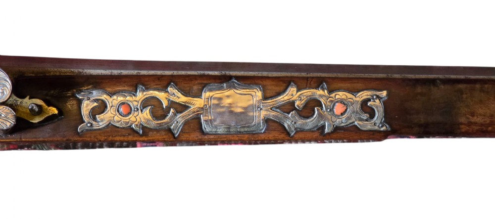 An 18th century Ottoman Algerian toe-lock long gun featuring a slender wooden stock decorated with brass bands and bone inlays. View VII