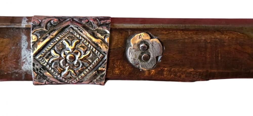 An 18th century Ottoman Algerian toe-lock long gun featuring a slender wooden stock decorated with brass bands and bone inlays. View XIV