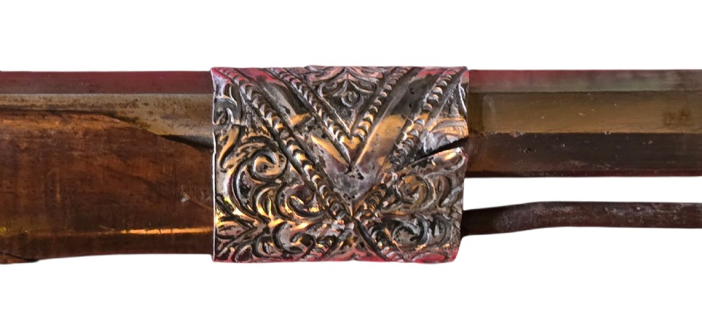 An 18th century Ottoman Algerian toe-lock long gun featuring a slender wooden stock decorated with brass bands and bone inlays. View XVI
