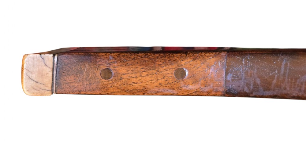 An 18th century Ottoman Algerian toe-lock long gun featuring a slender wooden stock decorated with brass bands and bone inlays. View XX