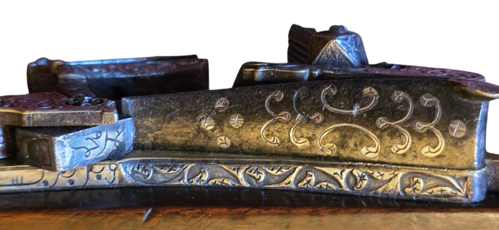 An 18th century Ottoman Algerian toe-lock long gun featuring a slender wooden stock decorated with brass bands and bone inlays. View XXII