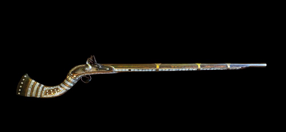 Fine Indo - Muslim Flintlock Musket/Jezail, extensively decorated with inset brass and Mother-of-Pearl Inlay, complete with Afghan stock c.1780–1820