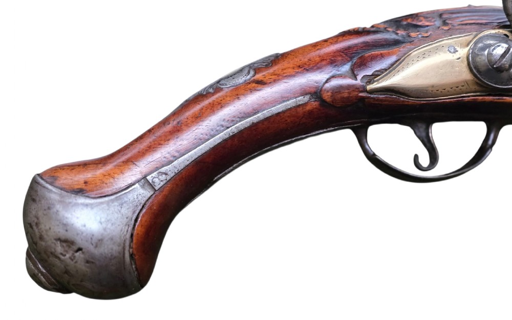 Fine German 18th C. Flintlock Holster Pistol by Hofmann, c.1750. With an ornately carved Walnut stock & brass lockplate.  View III