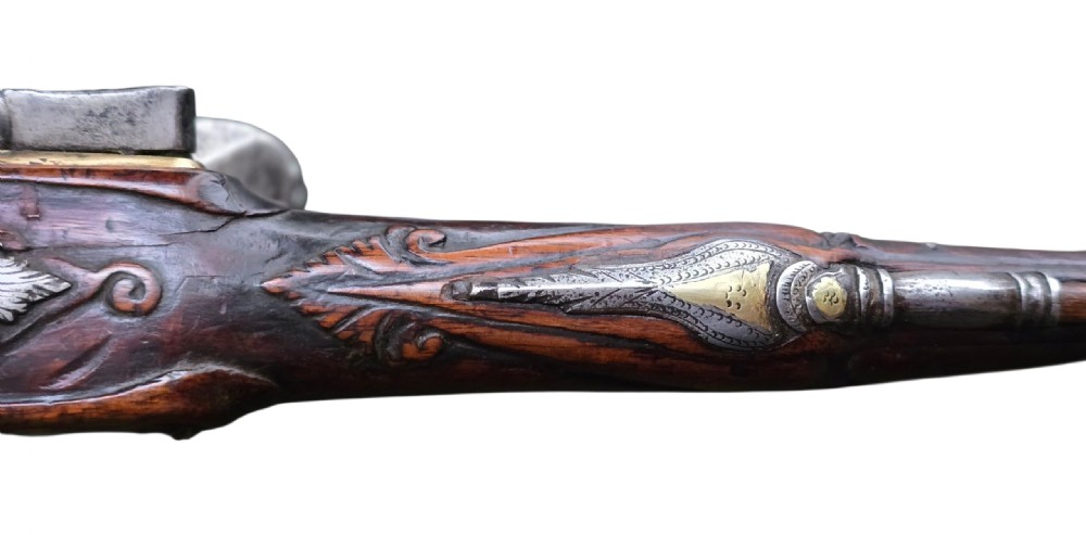 Fine German 18th C. Flintlock Holster Pistol by Hofmann, c.1750. With an ornately carved Walnut stock & brass lockplate.  View IV