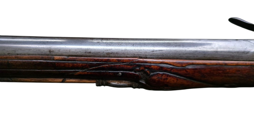 Fine German 18th C. Flintlock Holster Pistol by Hofmann, c.1750. With an ornately carved Walnut stock & brass lockplate.  View X