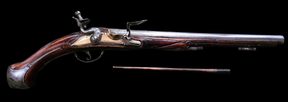 Fine German 18th C. Flintlock Holster Pistol by Hofmann, c.1750. With an ornately carved Walnut stock & brass lockplate.  View XI