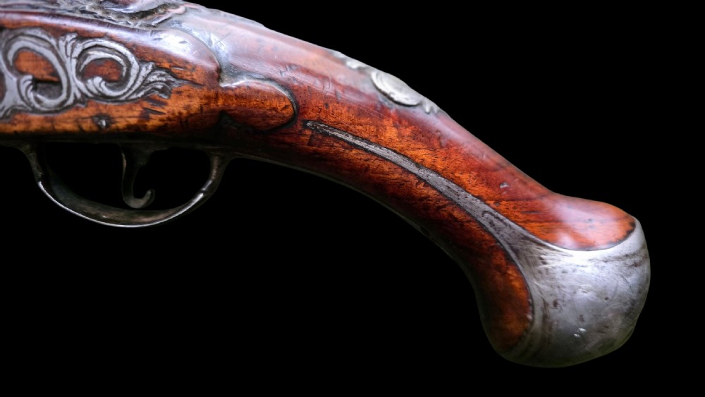 Fine German 18th C. Flintlock Holster Pistol by Hofmann, c.1750. With an ornately carved Walnut stock & brass lockplate.  View XIII
