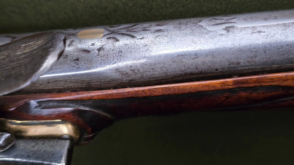 Fine German 18th C. Flintlock Holster Pistol by Hofmann, c.1750. With an ornately carved Walnut stock & brass lockplate.  View XX