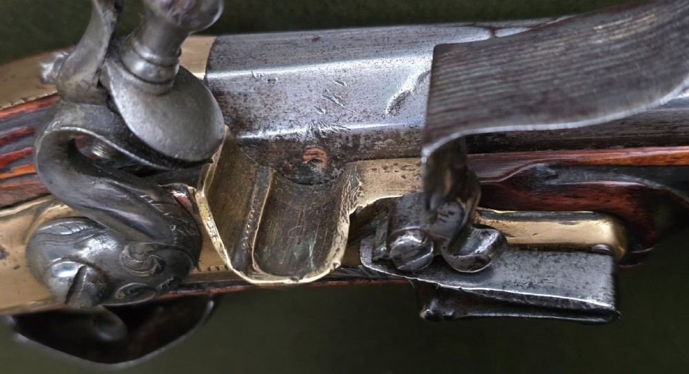 Fine German 18th C. Flintlock Holster Pistol by Hofmann, c.1750. With an ornately carved Walnut stock & brass lockplate.  View XXI