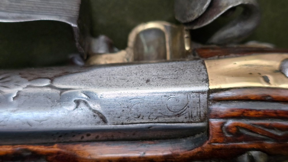 Fine German 18th C. Flintlock Holster Pistol by Hofmann, c.1750. With an ornately carved Walnut stock & brass lockplate.  View XXIII