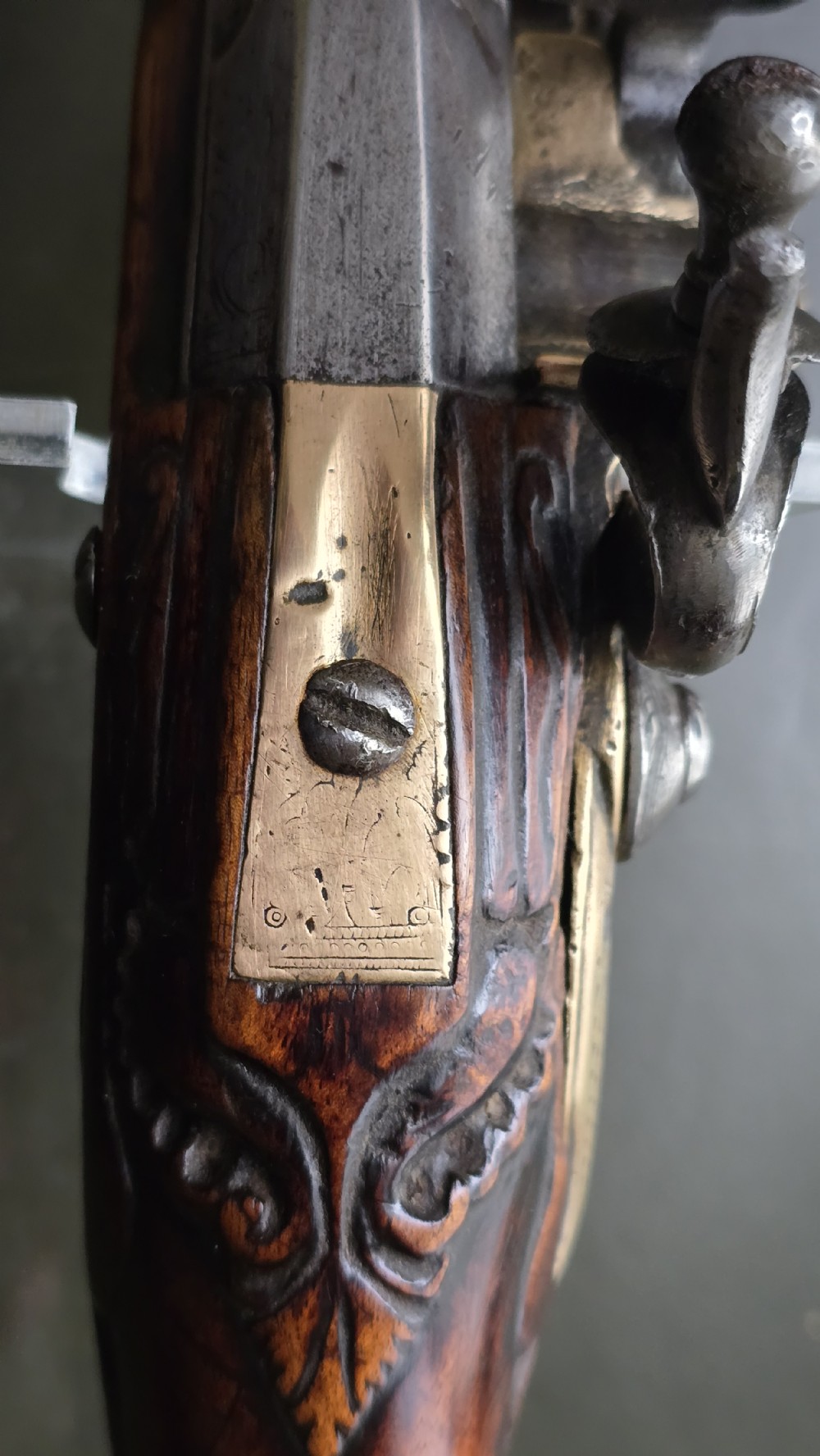 Fine German 18th C. Flintlock Holster Pistol by Hofmann, c.1750. With an ornately carved Walnut stock & brass lockplate.  View XXV