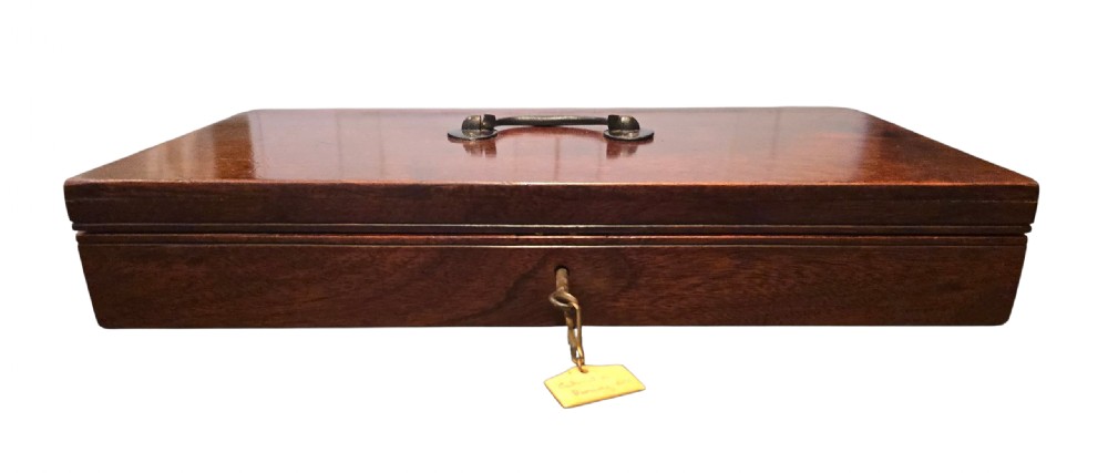 A fitted mahogany wooden case lined with green baize containing a pair of flintlock duelling pistols, a ramrod, and loading accessories. View III