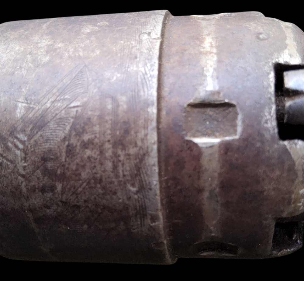 Side profile of a patinated steel Colt Model 1860 Army percussion revolver featuring a walnut handle grip and brass trigger guard. View XXIII