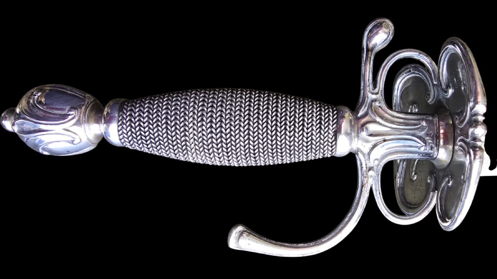An 18th-century silver-hilted smallsword converted into a short sword or dagger, featuring a decorated silver hilt with wire-bound grip and a tapered steel blade. View V