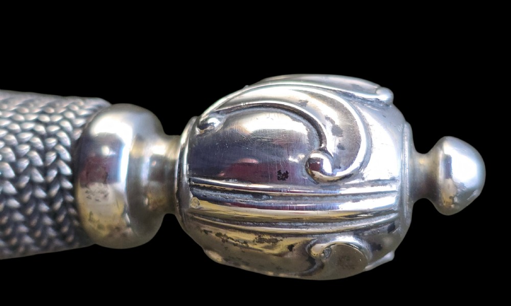 An 18th-century silver-hilted smallsword converted into a short sword or dagger, featuring a decorated silver hilt with wire-bound grip and a tapered steel blade. View VIII