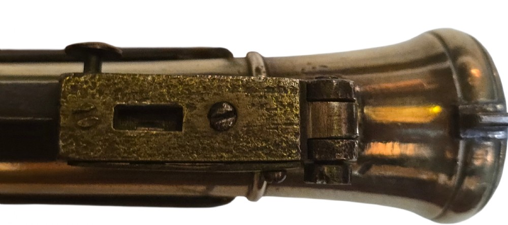 Late eighteenth-century British flintlock blunderbuss featuring a flared brass barrel, dark polished walnut stock, steel flintlock action, top-mounted sprung bayonet, and a separate wooden ramrod. View XX
