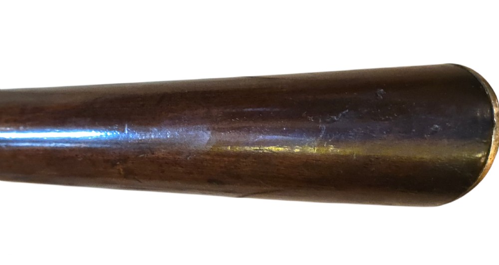 Late eighteenth-century British flintlock blunderbuss featuring a flared brass barrel, dark polished walnut stock, steel flintlock action, top-mounted sprung bayonet, and a separate wooden ramrod. View XXVIII