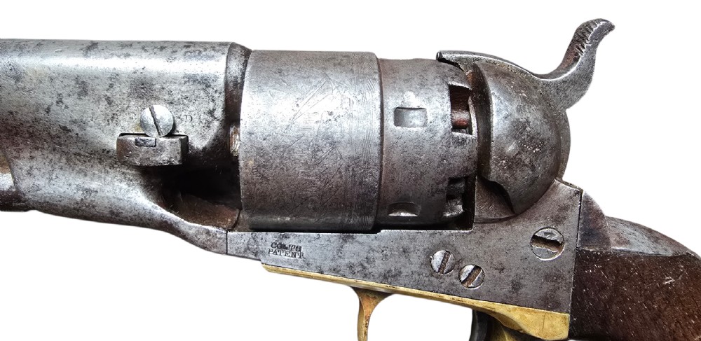 A 19th-century Colt Model 1860 Army percussion revolver featuring a steel barrel, creeping lever mechanism, brass trigger guard, and dark walnut grip. View VIII