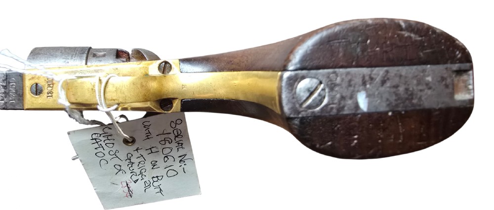 A 19th-century Colt Model 1860 Army percussion revolver featuring a steel barrel, creeping lever mechanism, brass trigger guard, and dark walnut grip. View XII