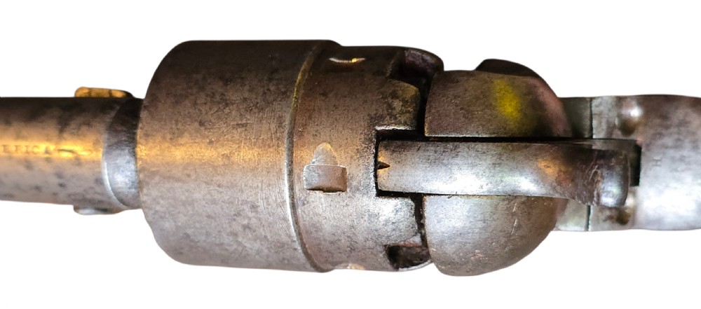 A 19th-century Colt Model 1860 Army percussion revolver featuring a steel barrel, creeping lever mechanism, brass trigger guard, and dark walnut grip. View XXI